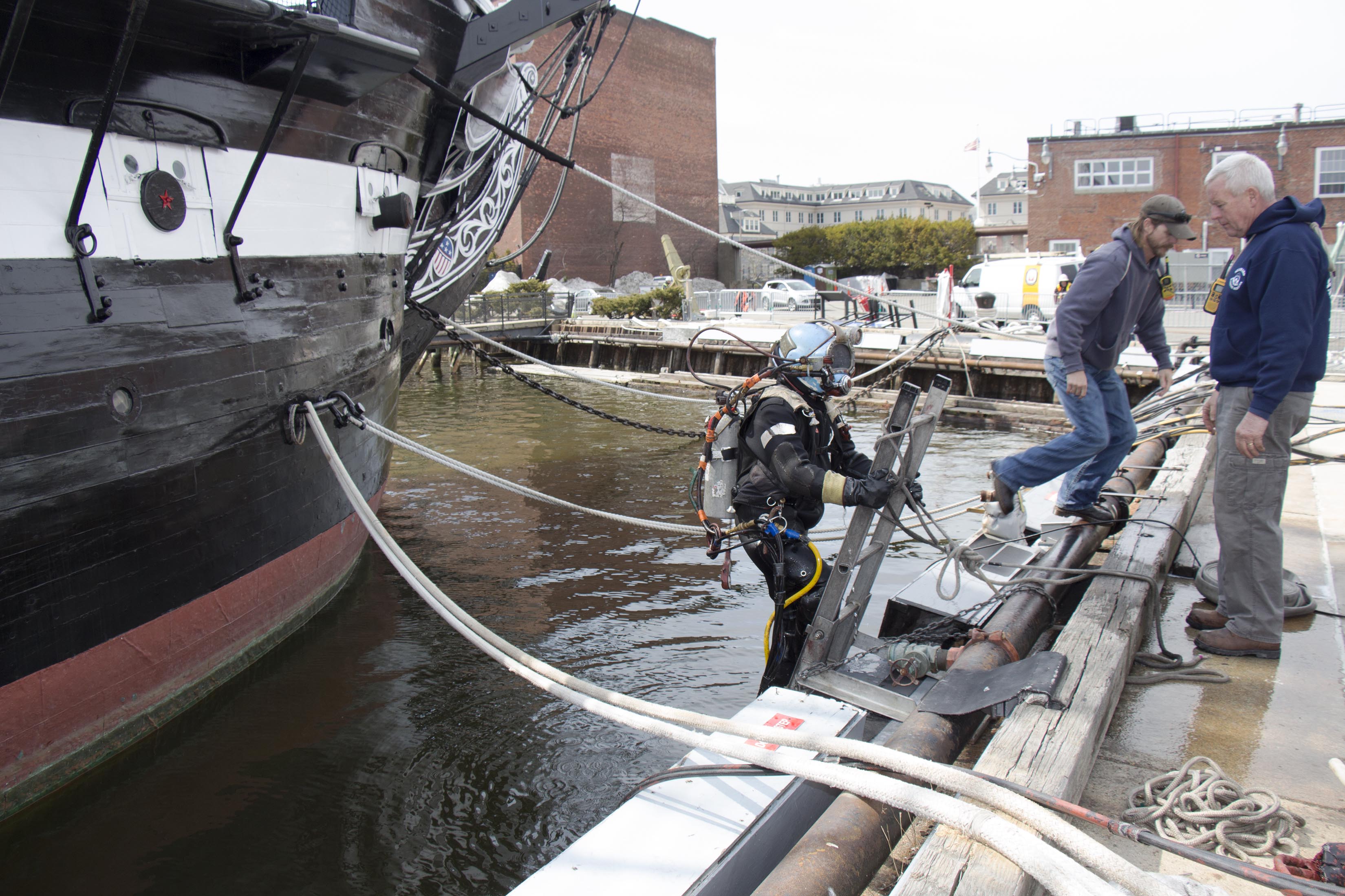 A diver with Seaward Marine Services, Inc. prepares to enter Boston Harbor to clean USS Constitution. [Courtesy USS Constitution Museum]