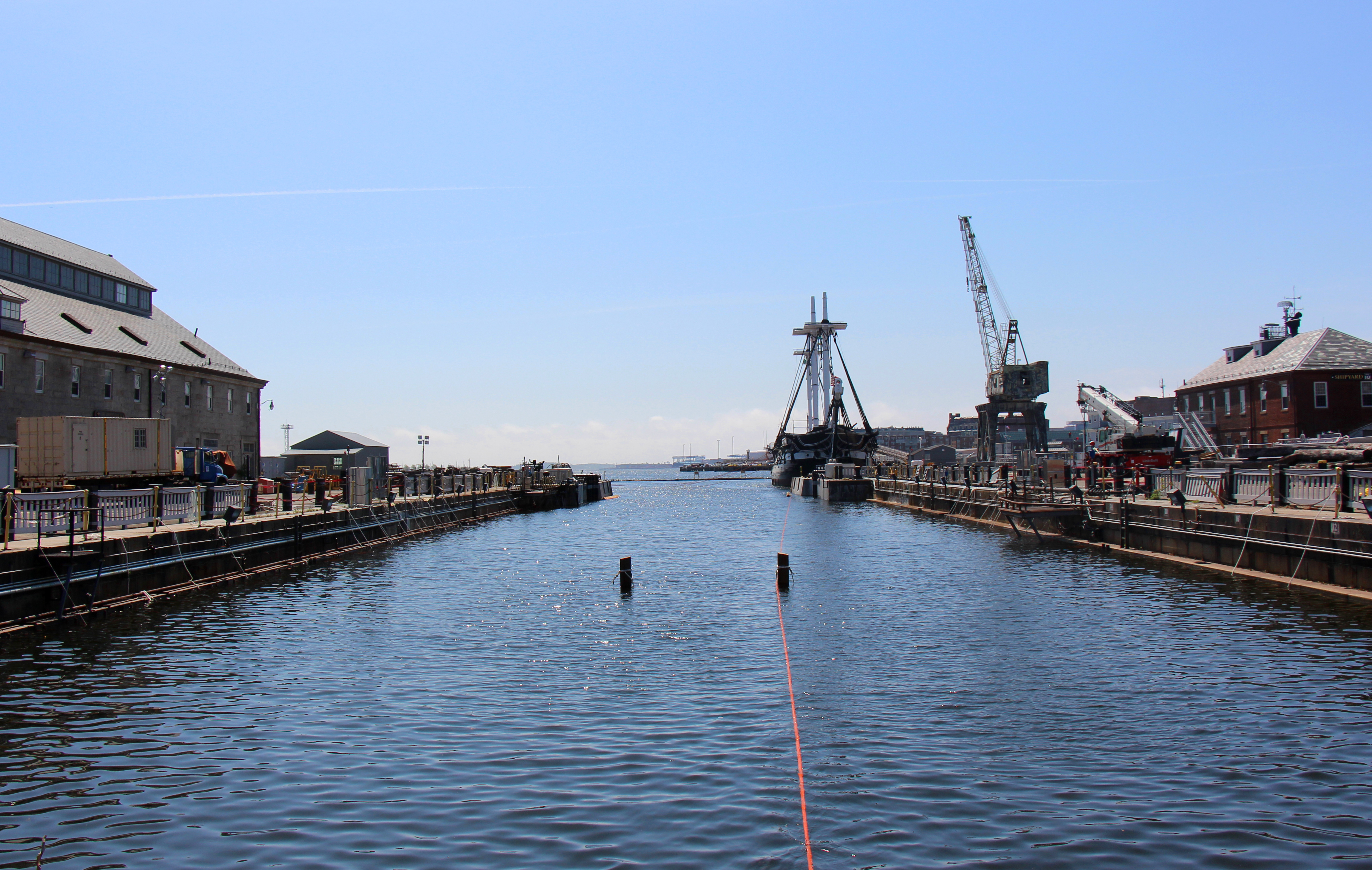 Dry Dock 1 filled with water, on May 18, 2015. USS Constitution is tied up in the background. [Courtesy USS Constitution Museum]