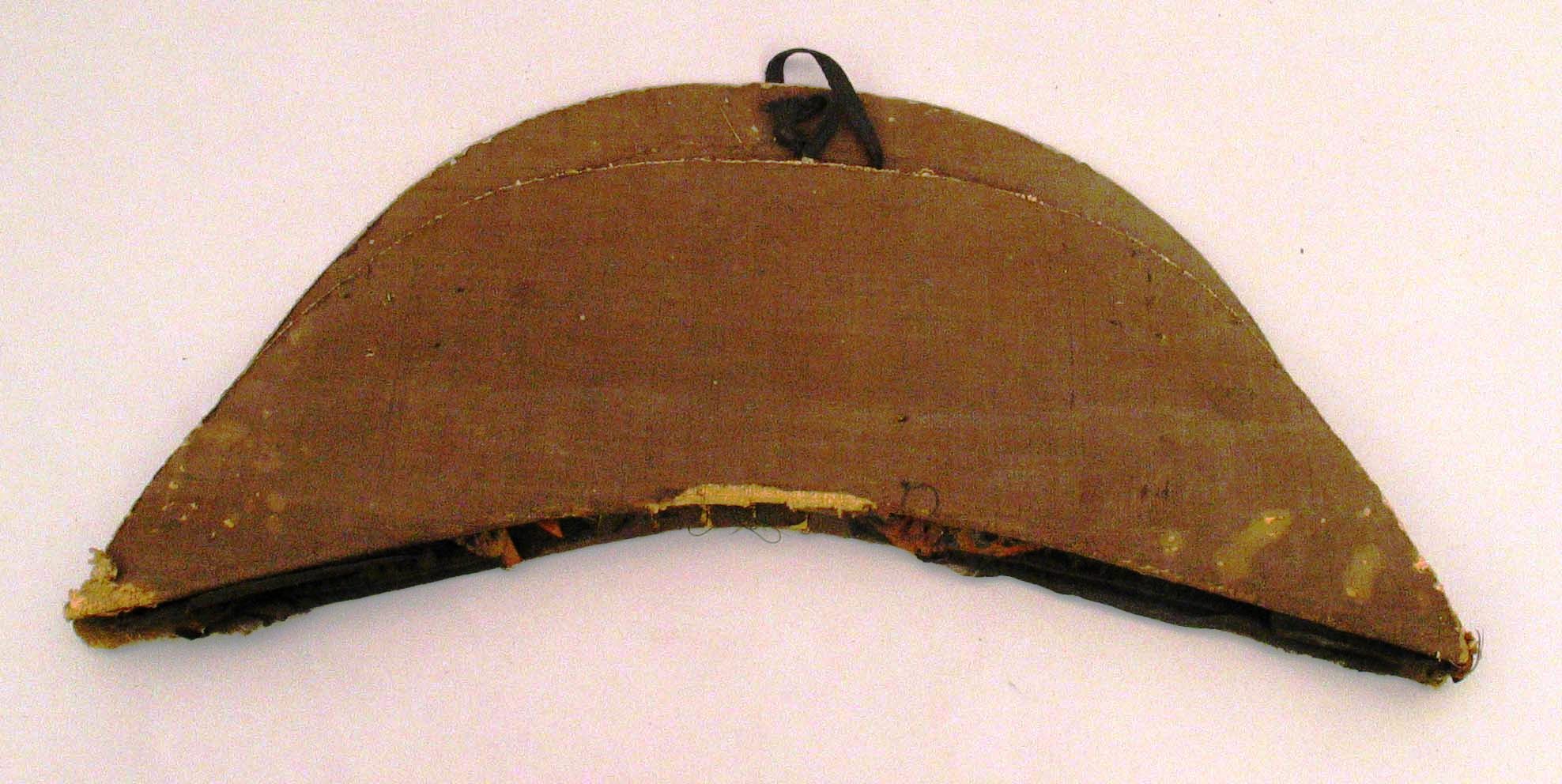 Cocked hat or chapeau bras owned by LT Pardon Mawney Whipple, about 1820. It has seen better days. Made of silk plush over buckram, the it is now stripped of its decorative binding, gilt lace loop, button, and cockade. USS Constitution Museum collection.