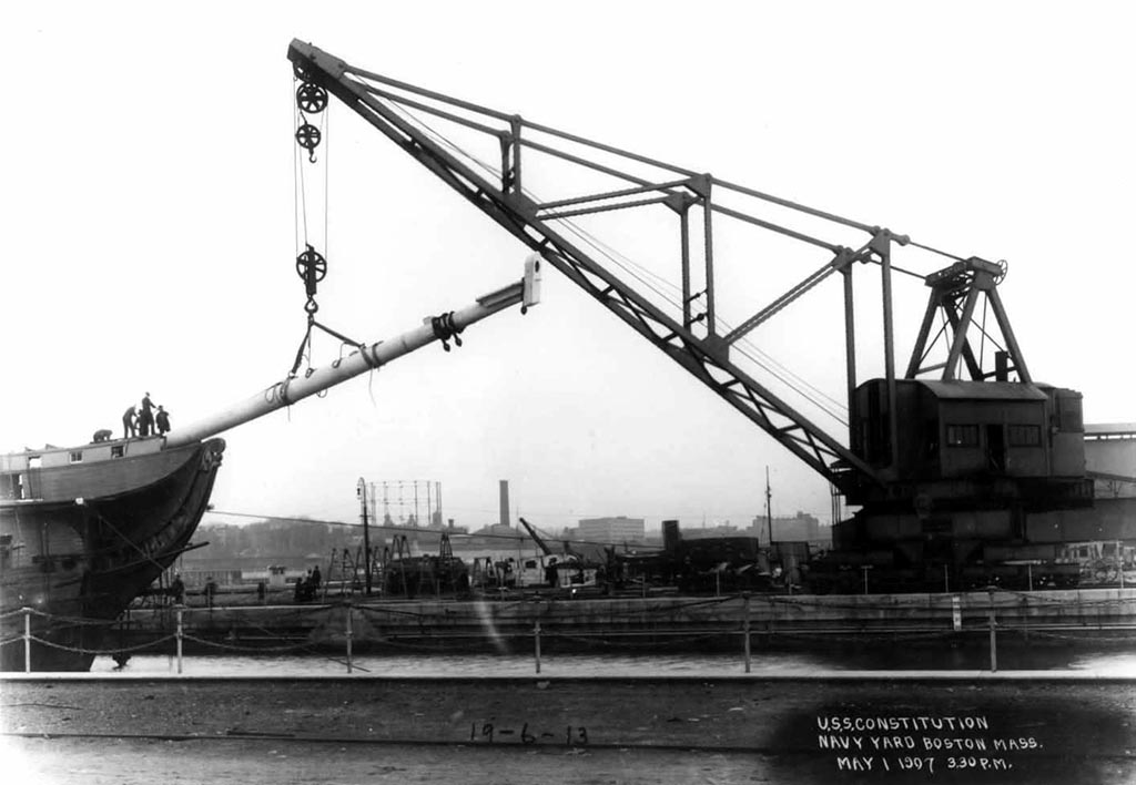 A crane is used during the 1906 restoration of USS Constitution in the Navy Yard, Boston, MA, on May 1, 1907 [Courtesy Boston National Historical Park]