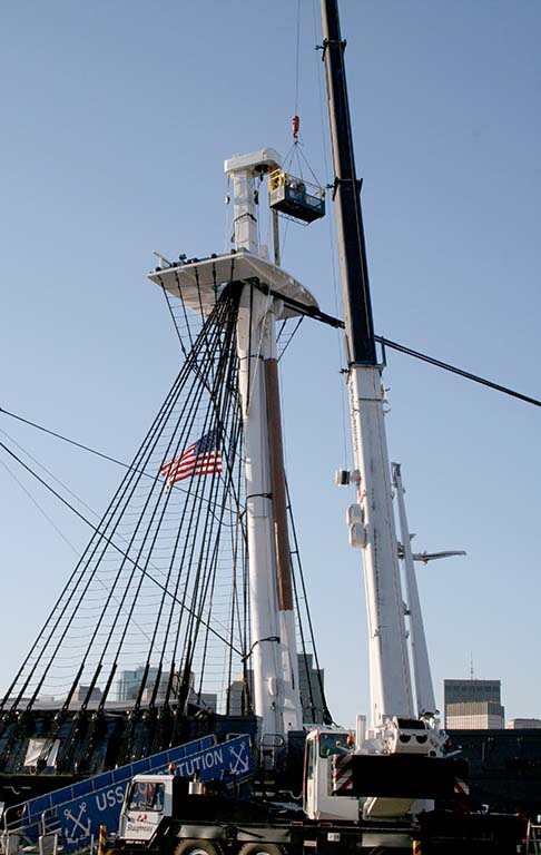 A crane removing the main topmast in 2007. [Courtesy Naval History & Heritage Command Detachment Boston. Photo by James Almeida]