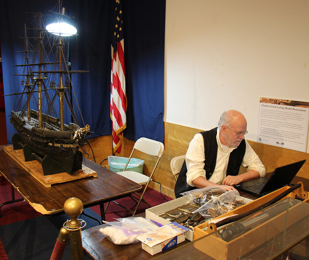 Rob Napier works on the Loring model in 2014 at the USS Constitution Museum. [Courtesy USS Constitution Museum]