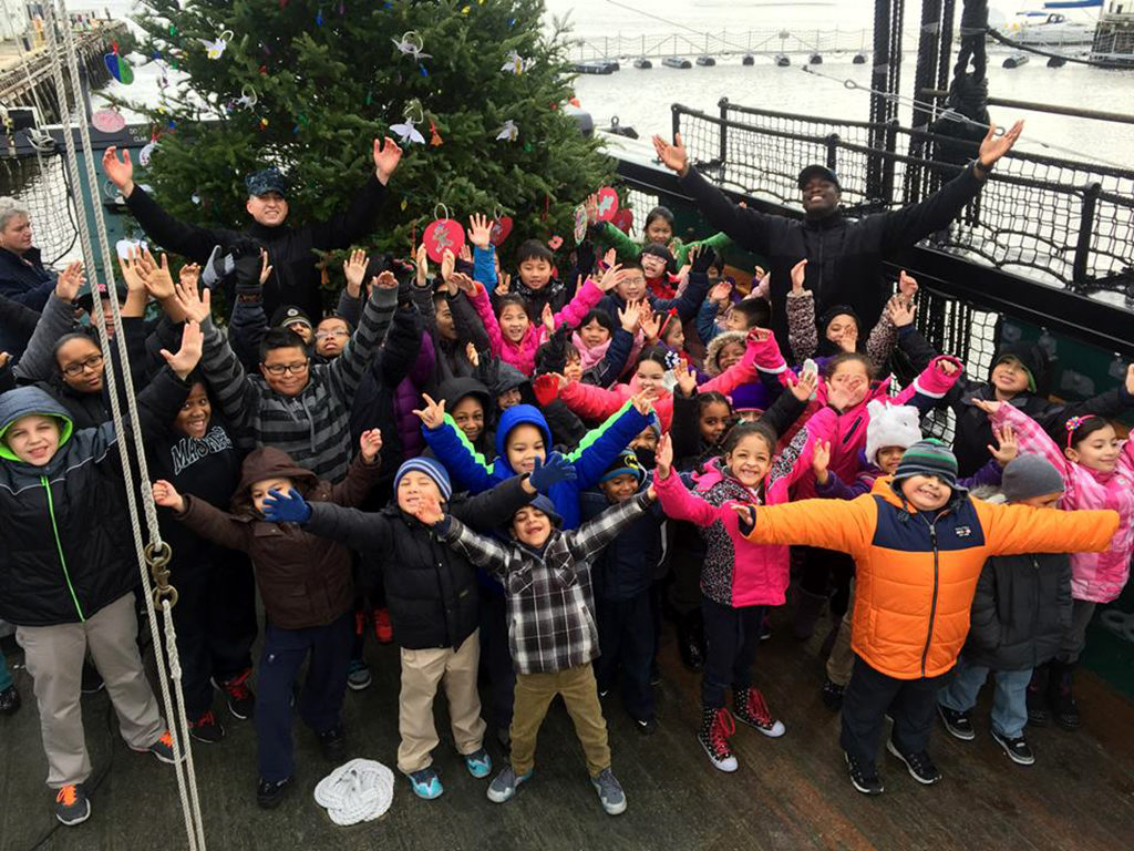 CHARLESTOWN, Mass. (Dec. 12, 2014) USS Constitution Sailors are joined by Charlestown-area schoolchildren to adorn Old Ironsides' 2014 Christmas tree with hand-made ornaments. (U.S. Navy photo by Religious Programs Specialist 2nd Class Dennis Lopez/Released)