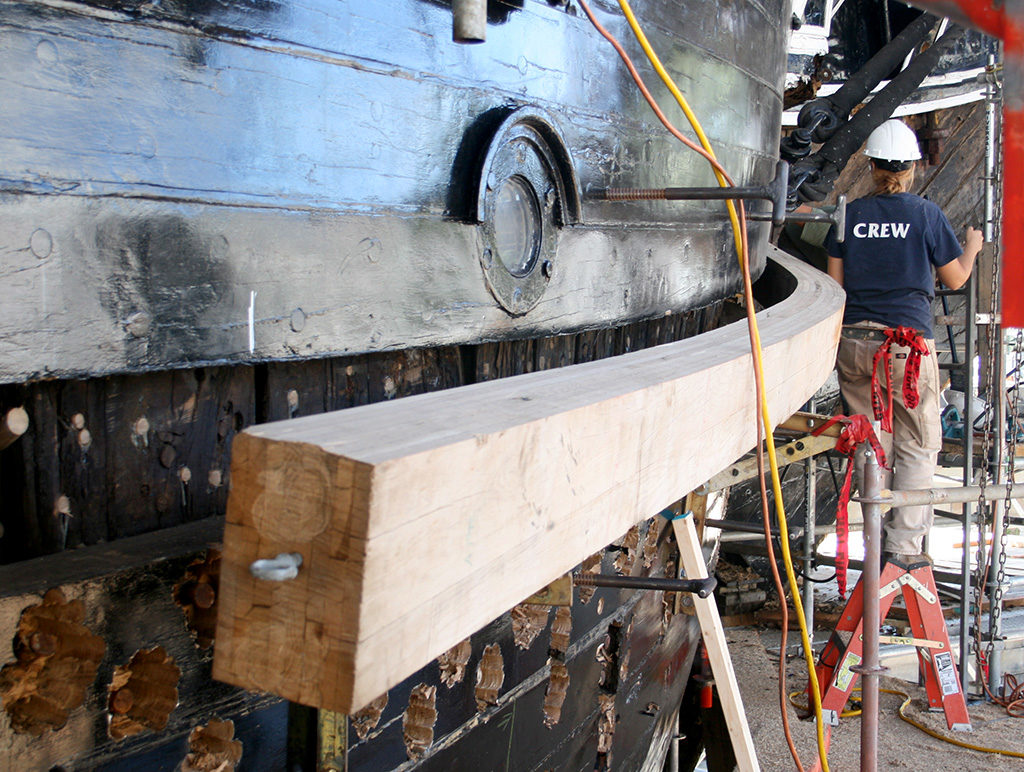 is a starboard bow plank going in - it's essentially the reverse of Rob removing the model's hull plank and exposing the framing behind