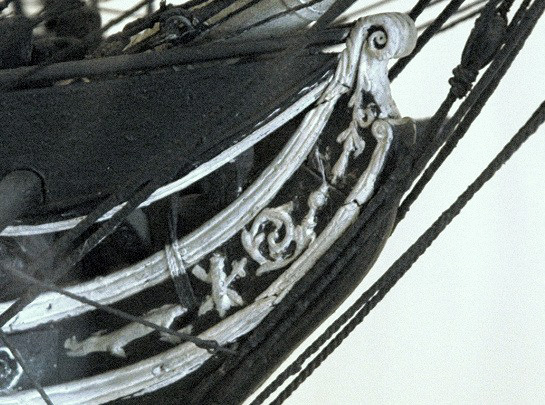 A detail of the c.1812 model of USS Constitution in the collection of the Peabody Essex Museum in Salem, Massachusetts. The model was made by the ship's crew for Captain Isaac Hull and therefore, it is believed, represents the warship as she would have appeared around the time of the battle with HMS Guerriere. This detail shows the 1808 billethead and "dragon" trailboards. [Peabody Essex Museum Collection. Photo courtesy Naval History & Heritage Command Detachment Boston]