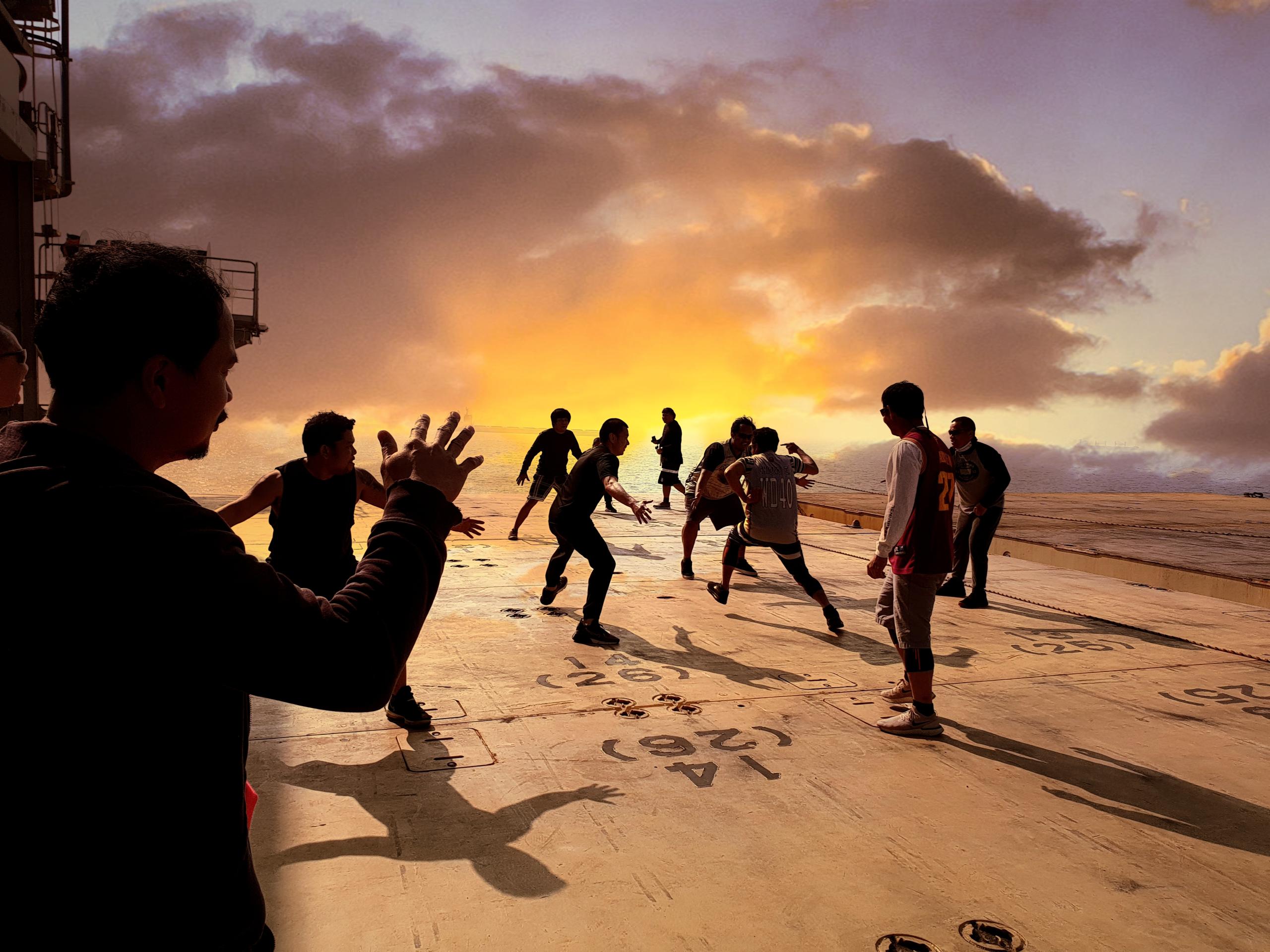 Crew at play on a vessel at anchor in China