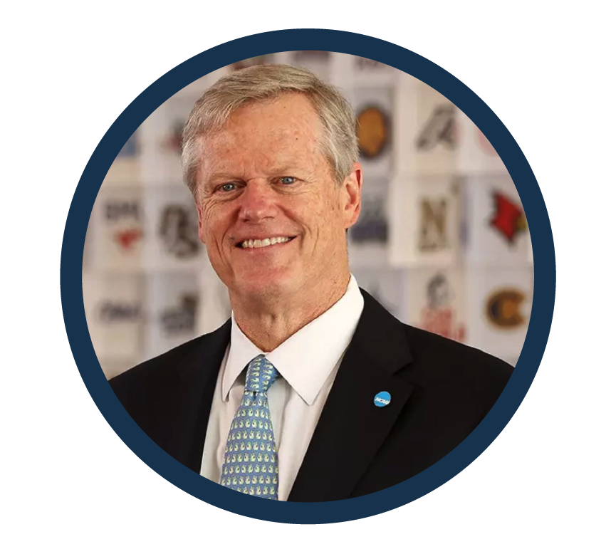 Headshot of Charlie Baker, former Governor of Massachusetts, wearing a dark suit, white shirt, and patterned tie, smiling against a neutral background.